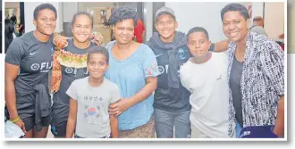  ?? Picture: BALJEET SINGH ?? Left: Fijiana Rugby players Vani Buleki (left), Younis Bese and Ivamere Nabure with their family members at the Nadi
Internatio­nal Airport.