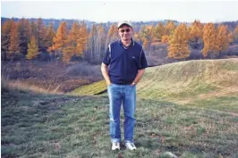  ?? COURTESY OF TRATTNER FAMILY ?? Steve Trattner stands on the land that he and Bob Lang would transform into Erin Hills.