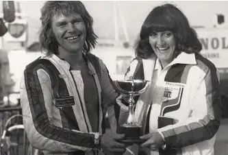  ??  ?? Behind every great man: Dave, trophy and better half Pauline: “My pillion passenger! It’s alright, she loves it!”
