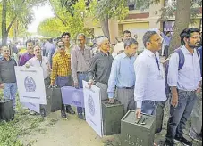  ??  ?? Polling officials carry ballot boxes and other election material before leaving for the polling stations on the eve of block developmen­t councils elections in Jammu on Wednesday.