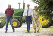  ?? ANDREW HARNIK / AP ?? President Joe Biden walks with O’connor Farms owners Jeff O’connor, left, and Gina O’connor, at the farm Wednesday in Kankakee, Ill.