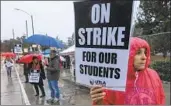  ?? Ringo H.W. Chiu Associated Press ?? TEACHER Orquidea Labrador pickets outside John Marshall High School in Los Feliz on Monday.