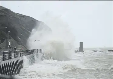  ??  ?? Strong winds at high tide batter the coast at Folkestone