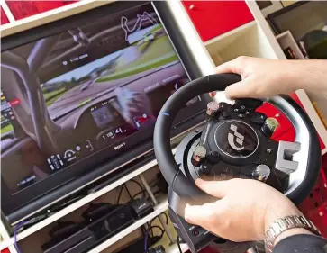  ??  ?? WHEEL A steering wheel and set of pedals are a must-have for anyone playing driving games on a console