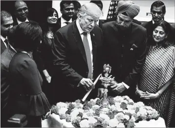  ?? ALEX WONG/GETTY ?? President Donald Trump celebrates Diwali, the Hindu festival of lights, during a ceremony Tuesday in the White House.