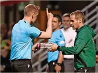  ?? ?? UNACCEPTAB­LE Ref hands Fir Park bottle to fourth official