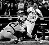  ?? DAVID J. PHILLIP/AP ?? Gary Sanchez fails to corral the throw as Jose Altuve scores the winning run for the Astros in Game 2.