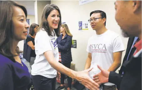  ?? Paul Chinn / The Chronicle ?? Republican Assemblywo­man Catharine Baker greets supporters. She is being challenged by Democrat Rebecca Bauer-Kahan.