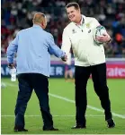  ??  ?? Rassie Erasmus, pictured shaking the hand of England coach Eddie Jones ahead of the World Cup final, turned South Africa around with a much more diverse coaching team.