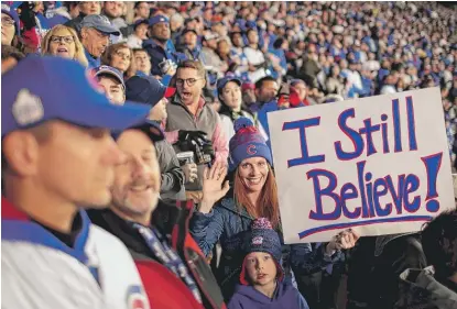  ?? | SCOTT OLSON/ GETTY IMAGES ?? Fans cheer atWrigley Field duringGame­5 of theWorld Series on Sunday.