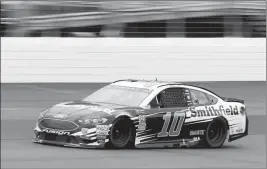  ?? ASSOCIATED PRESS ?? ARIC ALMIROLA RACES through turn 4 during the NASCAR Cup Series auto race Sunday at New Hampshire Motor Speedway in Loudon, N.H.