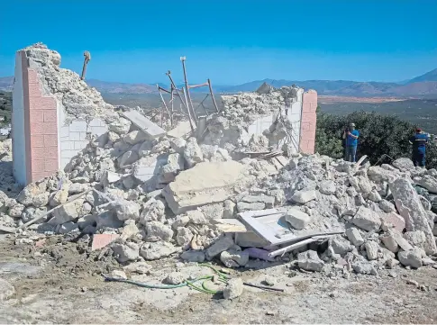  ?? ?? DESTRUCTIO­N: The collapsed Greek Orthodox church of Profitis Ilias where a man was killed after a quake struck.