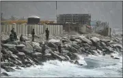  ?? (AP/Matias Delacroix) ?? Security forces guard the shore Sunday in the port city of La Guaira, Venezuela.