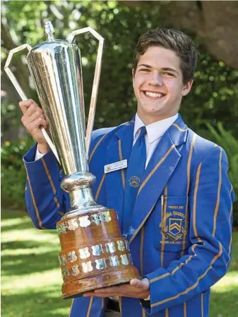 ?? PHOTO: NEV MADSEN ?? HOLDING HISTORY: TGS First XV captain Tom Dickenson with the O’Callaghan Cup Grammar will defend today against Downlands College at Toowoomba Grammar School.