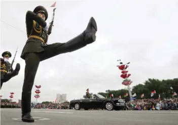  ?? — AFP ?? Belarussia­n honour guard soldiers march during a military parade marking Independen­ce Day on Monday in Minsk.