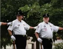  ?? MARIAN DENNIS — DIGITAL FIRST MEDIA ?? The Montgomery County Honor Guard stood above the Vietnam Memorial outside the Montgomery County courthouse Friday, taking part in the POW/MIA Day ceremony.