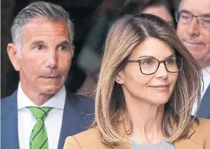  ?? STEVEN SENNE THE ASSOCIATED PRESS FILE PHOTO ?? Mossimo Giannulli and Lori Loughlin were accused of paying $500,000 to create fake applicatio­ns so their daughters could attend the University of Southern California as crew recruits.