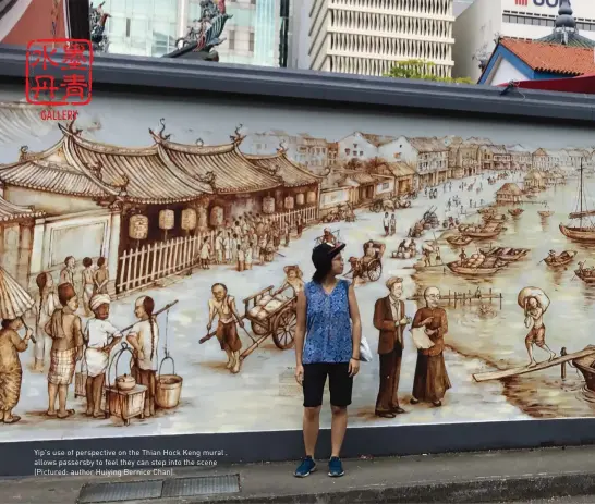  ??  ?? Yip’s use of perspectiv­e on the Thian Hock Keng mural allows passersby to feel they can step into the scene (Pictured: author Huiying Bernice Chan)