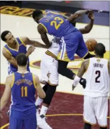  ?? TONY DEJAK — THE ASSOCIATED PRESS ?? Golden State’s Draymond Green (23) fouls Cleveland’s Tristan Thompson during Game 4 in Cleveland on Friday.