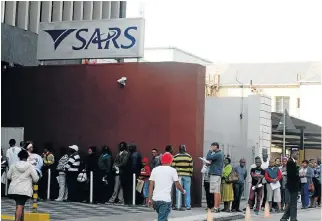  ?? /Fredlin Adriaan ?? Taxing queues: Taxpayers wait to be assisted with their income tax returns at the SARS office in Port Elizabeth. There is still no word on the release of a taxpayer bill of rights.