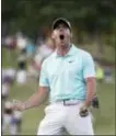  ?? JOHN BAZEMORE — THE ASSOCIATED PRESS ?? Rory McIlroy reacts after sinking a putt on the fourth hole to win the Tour Championsh­ip and the FedEx Cup last year Atlanta. in