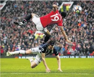  ?? PHOTO: REUTERS ?? Top flight action . . . Manchester United’s Marcus Rashford flies over West Bromwich Albion’s Jay Rodriguez during an English Premier League match at Old Trafford in Manchester yesterday.