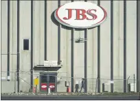  ?? FILE PHOTO: DAVID ZALUBOWSKI — THE ASSOCIATED PRESS ?? In this Oct. 12, 2020 file photo, a worker heads into the JBS meatpackin­g plant in Greeley, Colo. A weekend ransomware attack on the world’s largest meat company is disrupting production around the world just weeks after a similar incident shut down a U.S. oil pipeline.