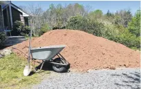  ?? RAY BATES ?? Enriched topsoil and the tools for its relocation provide healthy activities. It’s also a nice break from all the negative things happening in the world right now.