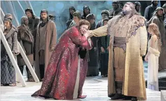  ?? Lawrence K. Ho Los Angeles Times ?? IN BELLINI’S “Norma” with the L.A. Opera in 2015, soprano Angela Meade performs with Robinson, who says that as an operatic bass singer he’s “just happy to get a dressing room” to himself.