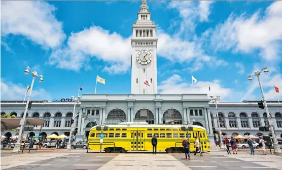  ?? PHOTOS: JUSTIN FRANZ/WASHINGTON POST ?? San Francisco’s historic Ferry Building, known for its clock tower, is among the stops on a vintage trolley tour through the city.
