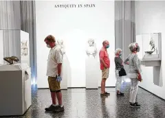  ??  ?? Museum members check out the “Glory of Spain” temporary exhibit.