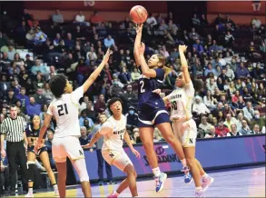  ?? Christian Abraham / Hearst Connecticu­t Media ?? Notre Dame-Fairfield’s Aizhanique Mayo (2) lays up to score against Newington during the Class L state championsh­ip game at Mohegan Sun Arena in Uncasville on March 19.