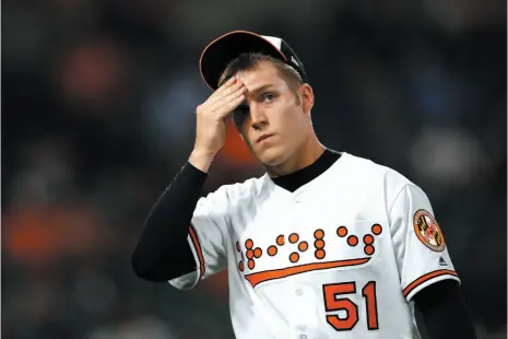  ?? AP PHOTO ?? Baltimore Orioles relief pitcher Paul Fry walks off the field after the seventh inning of Tuesday’s game against the Toronto Blue Jays. Toronto scored four runs against Fry in the seventh and went on to win 6-4.