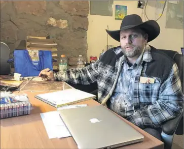 ?? Keith Ridler Associated Press ?? AMMON BUNDY, pictured last month before his arrest, has called on his group’s four holdouts to leave the refuge peacefully. They have said they won’t leave unless they are assured they won’t be charged.