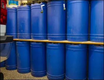  ??  ?? Barrels of water stored in the home garage of Cory and Holly Steed in Las Vegas.