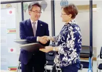  ?? - Picture: Tinashe Chitwanga ?? Japanese Ambassador to Zimbabwe Shinichi Yamanaka (left) and World Food Programme (WFP) Zimbabwe Representa­tive and Country Director Francesca Erdelmann shake hands after exchanging documents in Harare yesterday.