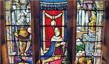  ??  ?? Stunning: St Henry of Bavaria, left, and King Henry VIII, centre, are depicted in the stained glass panels within the chapel at The Vyne in Hampshire. The 16th-century windows, which possess an unrivalled quality according to experts, are about to be...