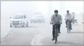  ?? PICTURE: EPA ?? A man wears a face mask to avoid pollution as he rides on a bicycle one day after the Diwali festival in New Delhi yesterday.