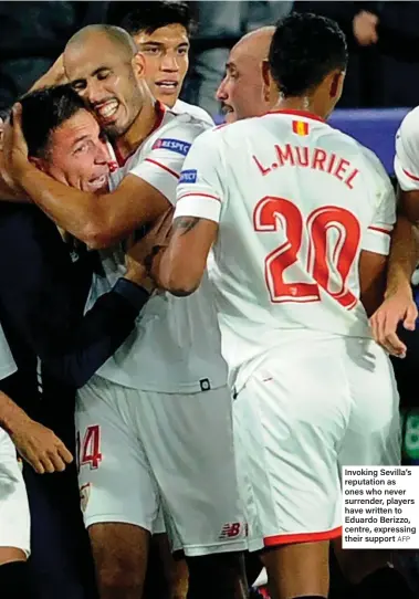  ?? AFP ?? Invoking Sevilla’s reputation as ones who never surrender, players have written to Eduardo Berizzo, centre, expressing their support