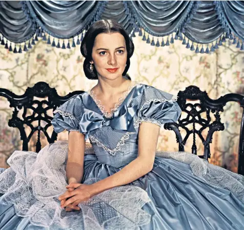 ??  ?? Olivia de Havilland as Melanie in Gone With the Wind, above, and at 101, left, the age she was made a dame