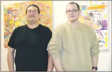  ?? NWA Democrat-Gazette/CARIN SCHOPPMEYE­R ?? Artist Jeffry Cantu (left) and Zachary Tally stand in front of some of Cantu’s work in Interiors in Context.