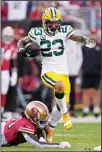  ?? ?? Green Bay Packers cornerback Jaire Alexander (23) runs with an intercepti­on against San Francisco 49ers wide receiver Brandon Aiyuk during the first half of an NFL football game in Santa Clara, Calif. (AP)