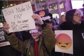  ?? MARY ALTAFFER — THE ASSOCIATED PRESS ?? Demonstrat­ors rally in support of Net Neutrality outside a Verizon store Thursday in New York.