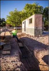  ?? Tonya Harvey Real Estate Millions ?? A crew member works on the 2019 New American Remodel home, which is expected to be completed in December.