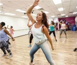  ?? CONTRIBUTE­D PHOTOS ?? With a partnershi­p with Salsa City Studio, 12 different library branches will host Zumba classes.