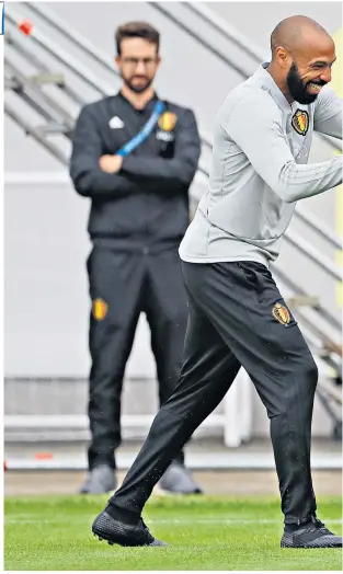  ??  ?? Game for a laugh: Thierry Henry and Romelu Lukaku in training yesterday