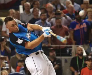  ?? MIKE EHRMANN, GETTY IMAGES ?? Aaron Judge competes in Major League Baseball’s all-star Home Run Derby at Marlins Park in Miami on Monday night. Judge dominated the competitio­n in the same manner he has smashed his way through his rookie season. The New York Yankees slugger beat...