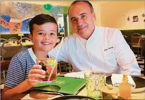  ?? Contribute­d photo / Tommy Kelly ?? Instagram star and TV personalit­y Leo Kelly, left, of @TheShirley­TempleKing fame at Happy Monkey on Greenwich Avenue with chef Jean-Georges Vongericht­en.