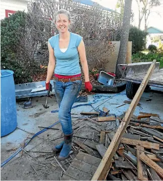  ??  ?? Nisha Duncan busy on the renovation­s at Eco Villa in central Christchur­ch.