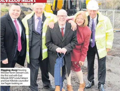  ??  ?? Digging deepHousin­g Minister Kevin Stewart cuts the first sod with East Kilbride MSP Linda Fabiani and East Kilbride councillor Joe Fagan looking on